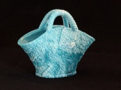 Blue/green malachite glass basket with basket weave and flower decoration