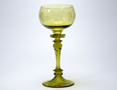 Sowerby green wrythen wine glass with grape vine engraving