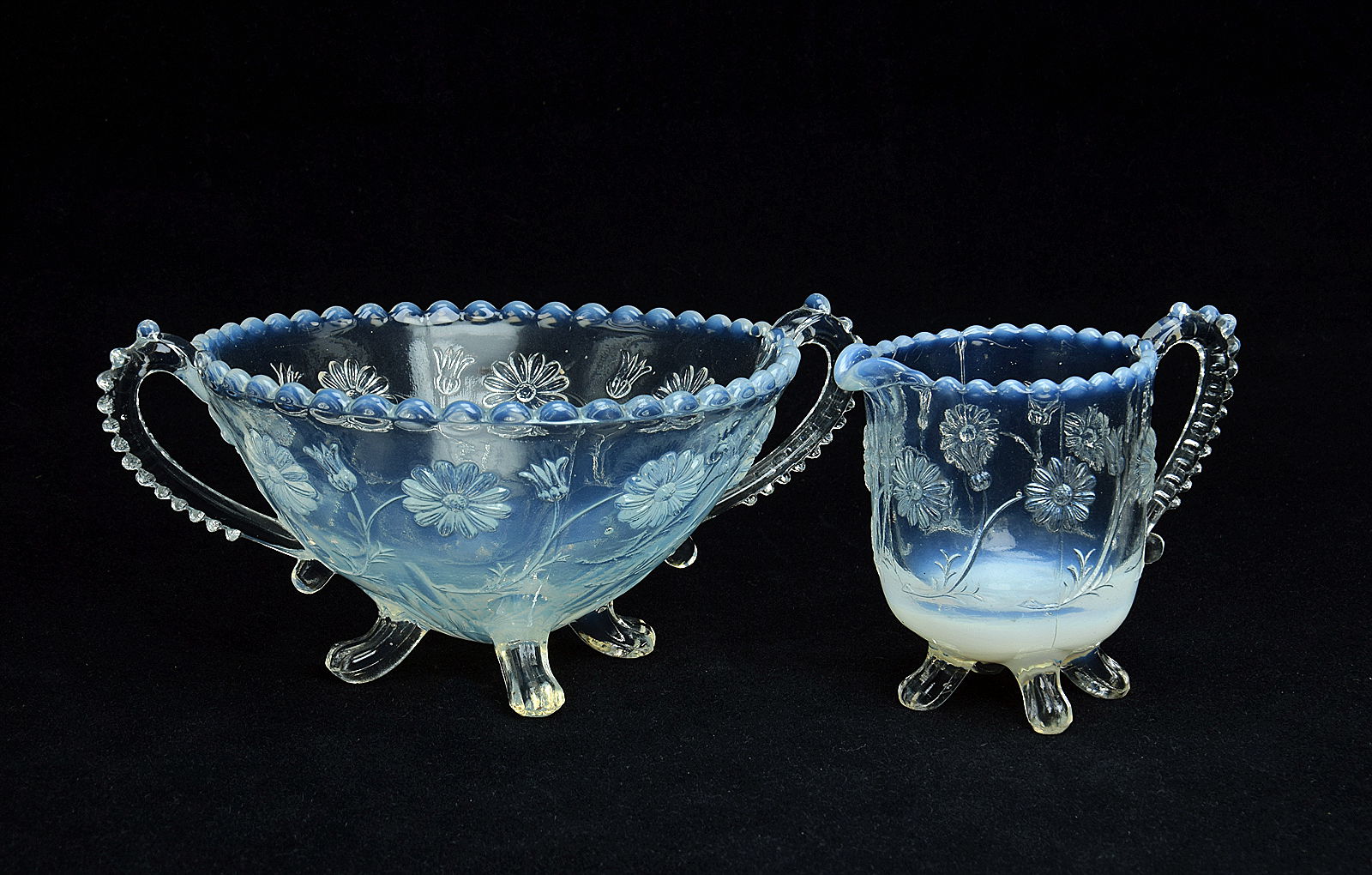 Sowerby opalescent Blanc de Lait, sugar and cream with four feet, two handles and daisy decoration