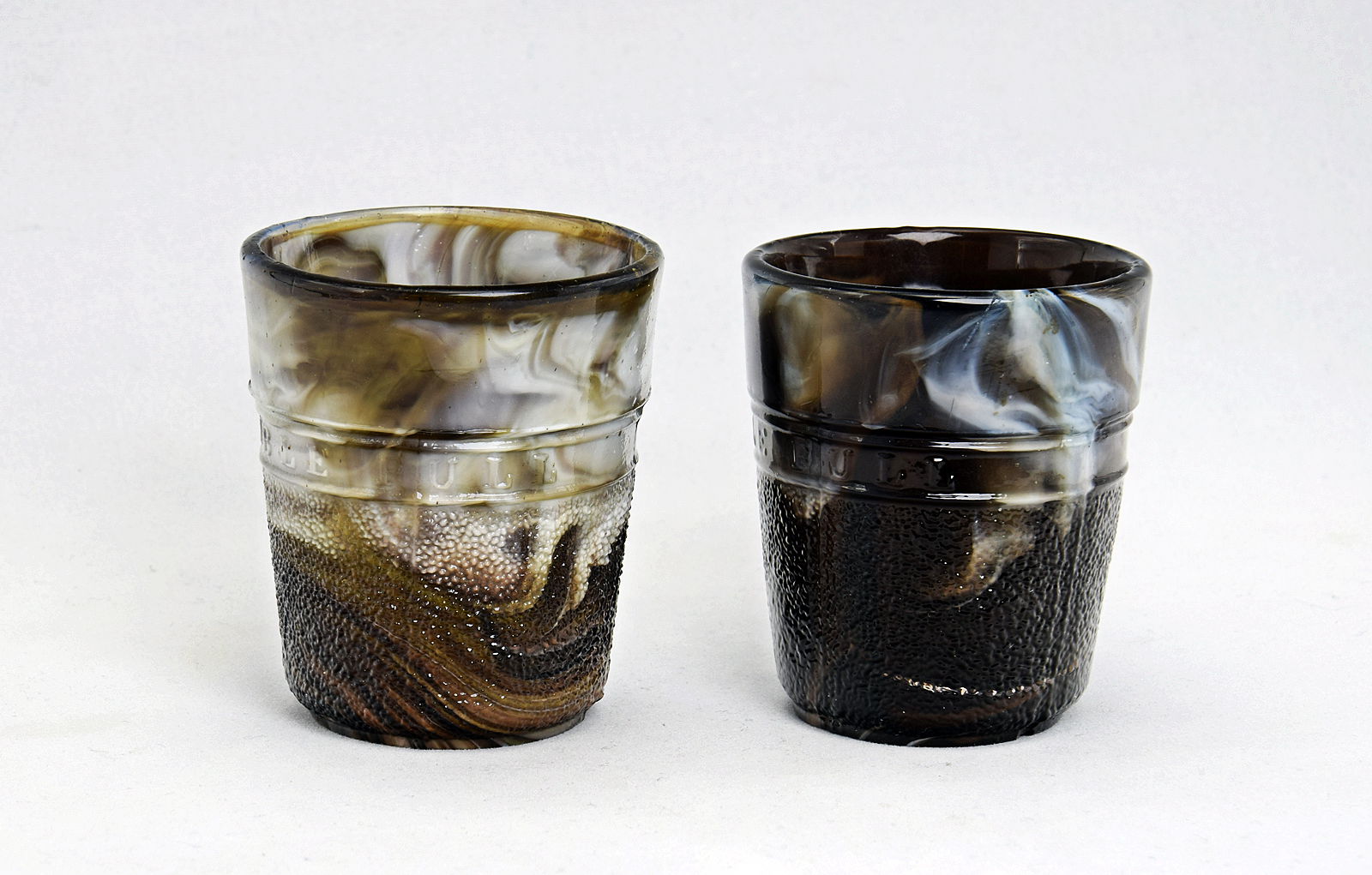 Sowerby brown malachite, pair of small tumblers in the shape of a thimbles, marked 'Just a Thimble Full'