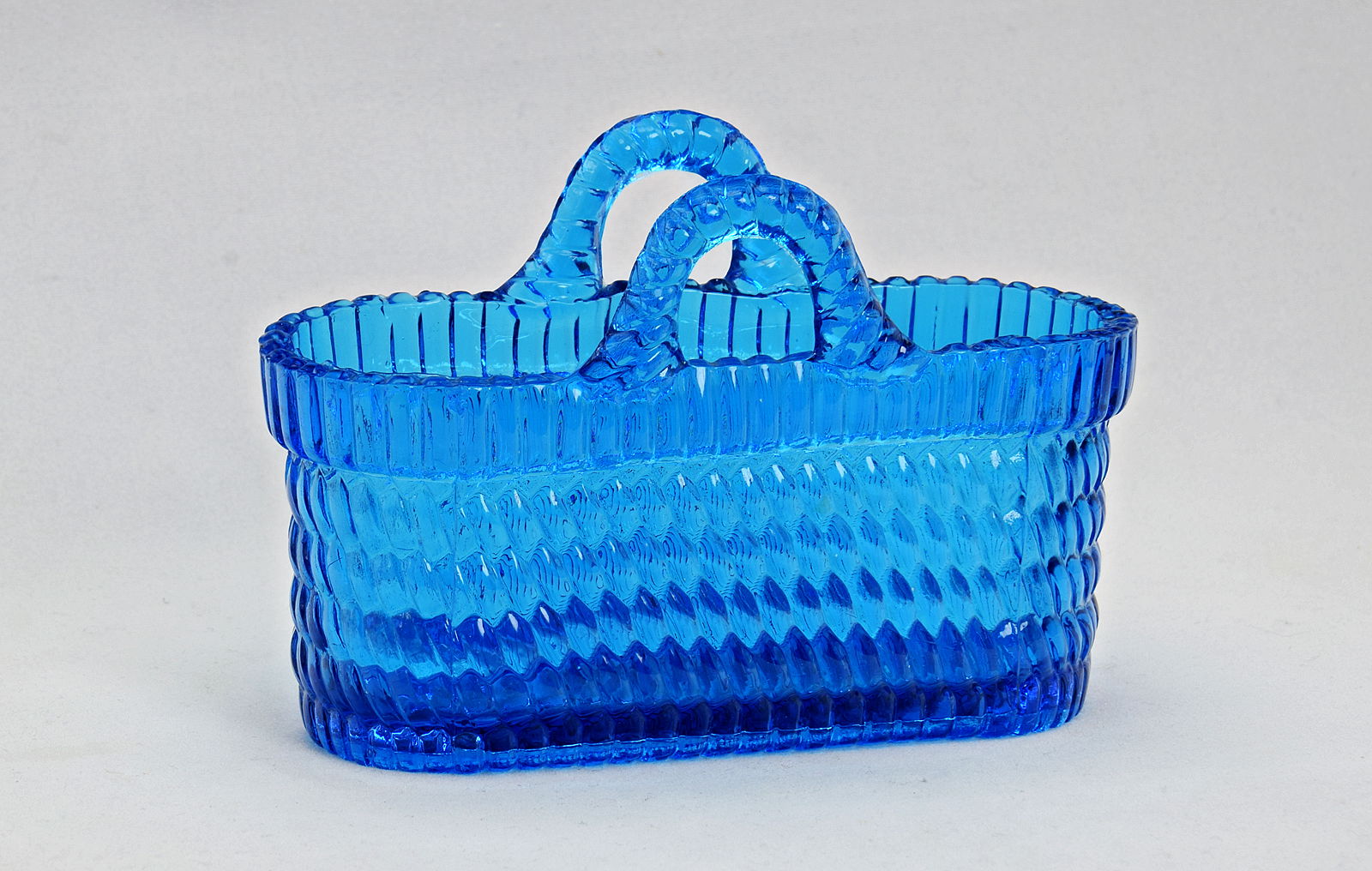 Sowerby translucent blue oblong basket weave posy