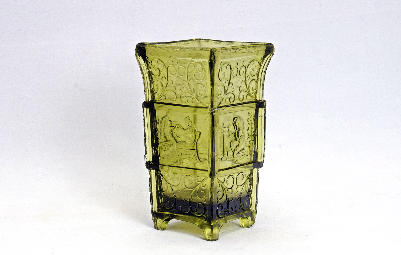 Sowerby translucent olive green vase with Designs from tiles by Maw & Co