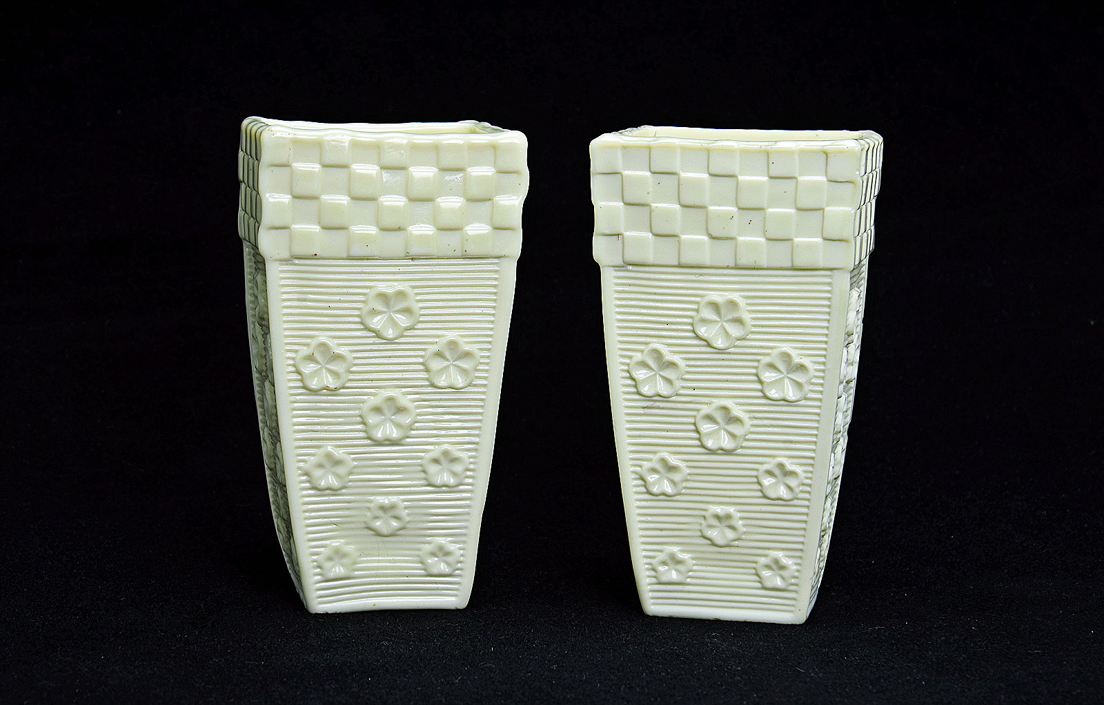 Sowerby Ivory Queensware, pair of spill vases with flower head and brick decoration