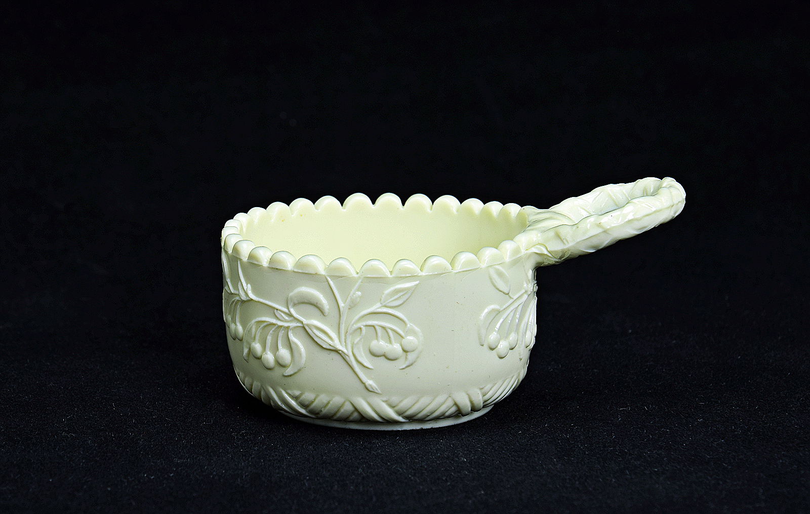 Sowerby Ivory Queensware, small small salt with single handle and cherry blossom decoration