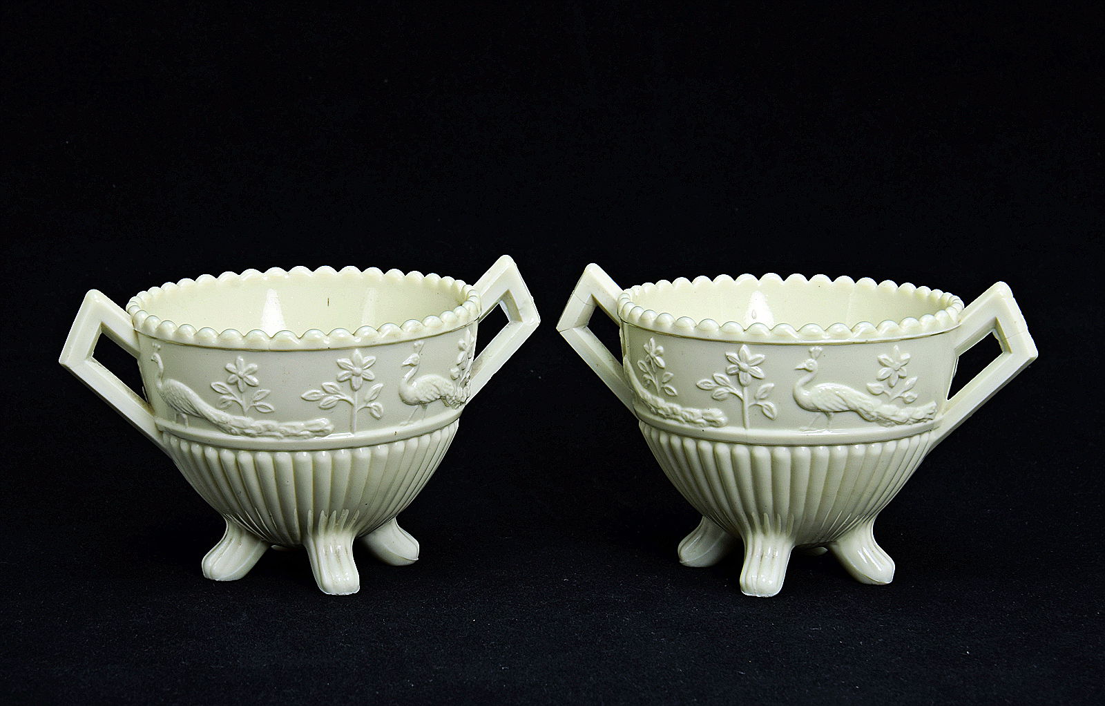 Sowerby Ivory Queensware, pair flower posies with peacock decoration