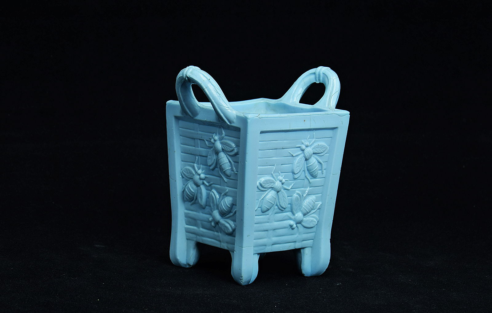 Sowerby turquoise blue, small 4 sided vase with 4 feet, 2 handles, decorated with bees
